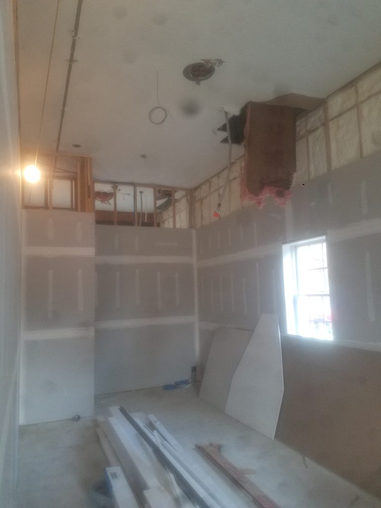 UNFINISHED HOME SHOWING ELECTRICAL WORK BEING DONE BY ELECTRICIAN