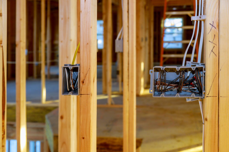 Electrical-socket-boxes-with-wires-of-wooden-beams-in-a-wall