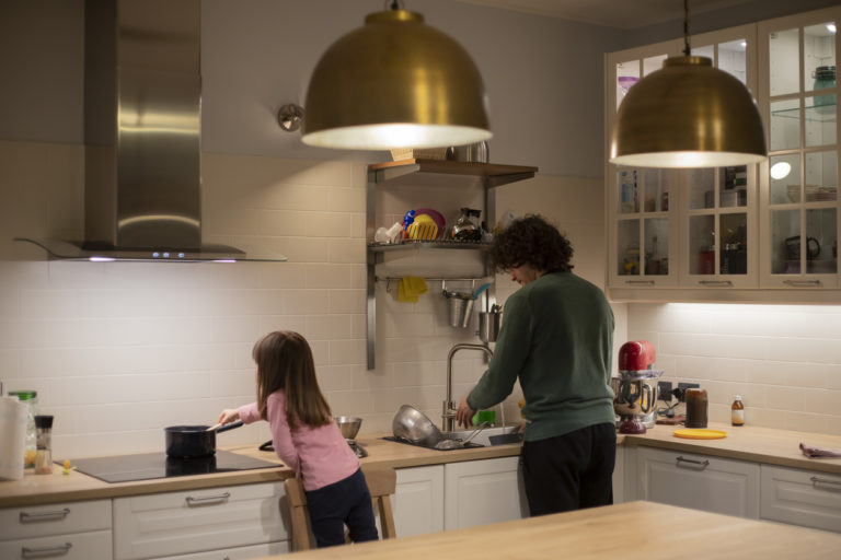 father-and-little-child-girl-back-view-cooking-together